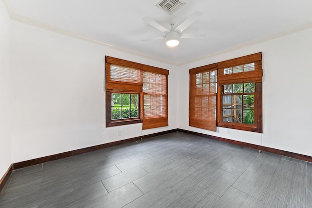 spare room with ceiling fan and crown molding