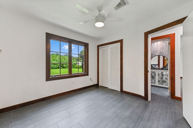 unfurnished bedroom with a closet and ceiling fan