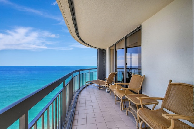 balcony featuring a water view