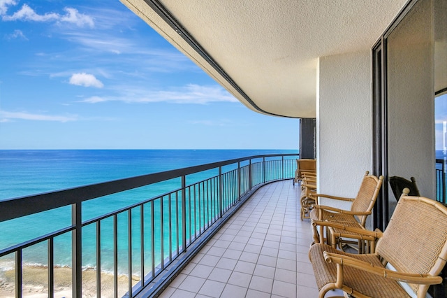 balcony with a view of the beach and a water view