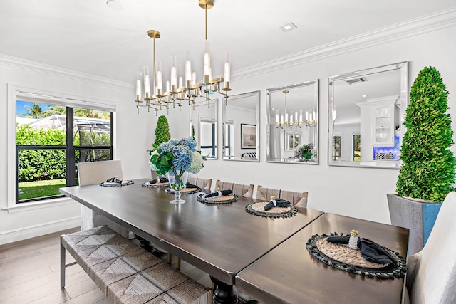 dining room with crown molding and wood-type flooring