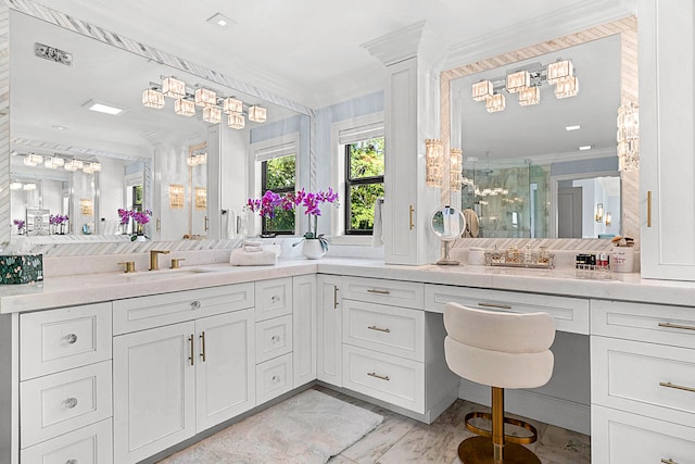 bathroom featuring vanity, ornamental molding, and a shower with door