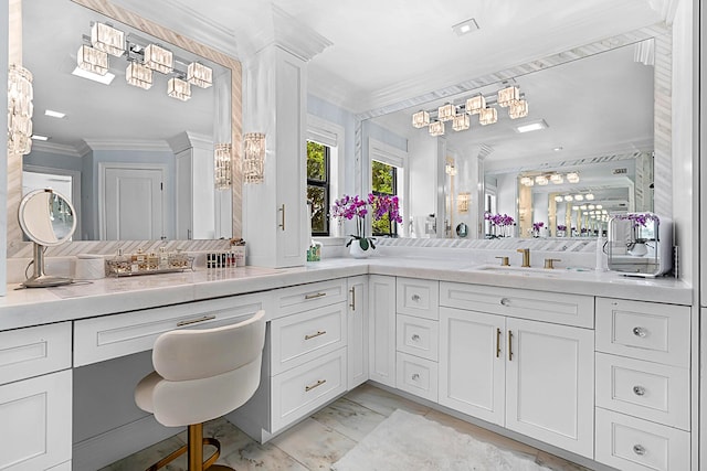 bathroom with ornamental molding and vanity