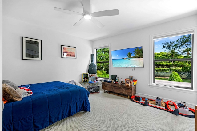 carpeted bedroom with ceiling fan