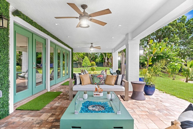 view of patio / terrace with ceiling fan and french doors