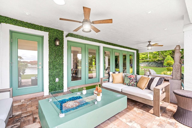 view of patio / terrace featuring outdoor lounge area, french doors, and ceiling fan