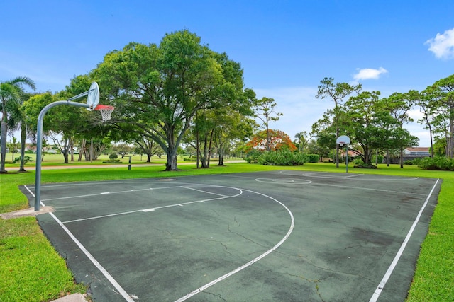 view of basketball court featuring a lawn