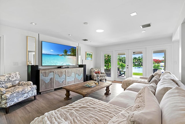 living room featuring french doors and hardwood / wood-style flooring