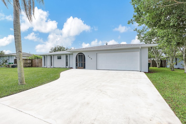 ranch-style house with a front yard and a garage