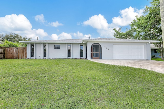 ranch-style house with a garage and a front lawn