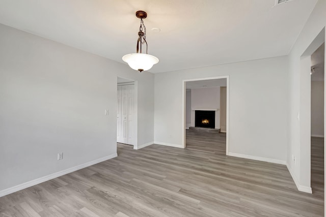 unfurnished room featuring wood-type flooring