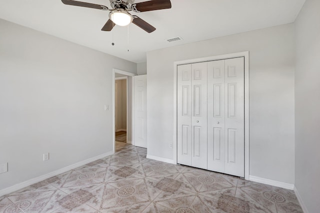 unfurnished bedroom featuring a closet and ceiling fan