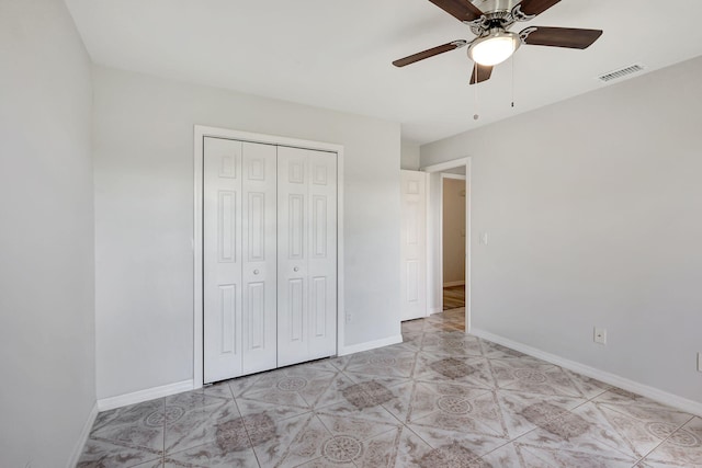 unfurnished bedroom featuring a closet and ceiling fan