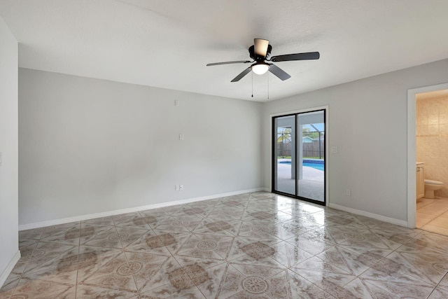 empty room with ceiling fan and light tile patterned flooring