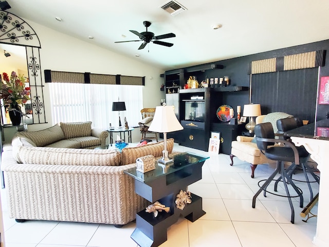 tiled living room featuring lofted ceiling and ceiling fan