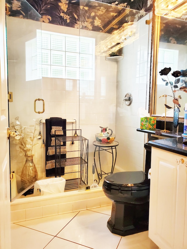 bathroom with walk in shower, vanity, and toilet