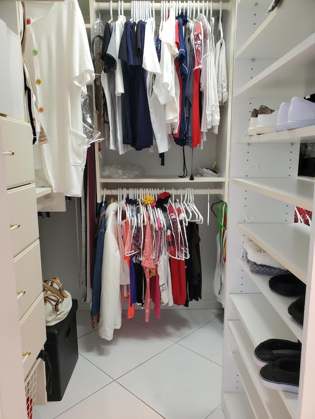 spacious closet featuring tile patterned flooring