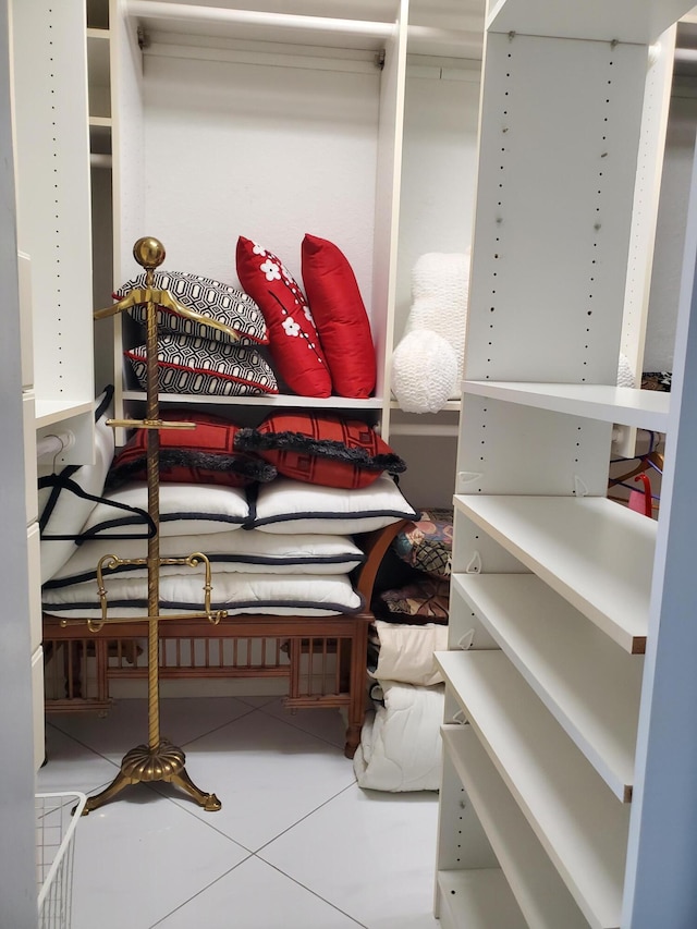 walk in closet featuring tile patterned flooring