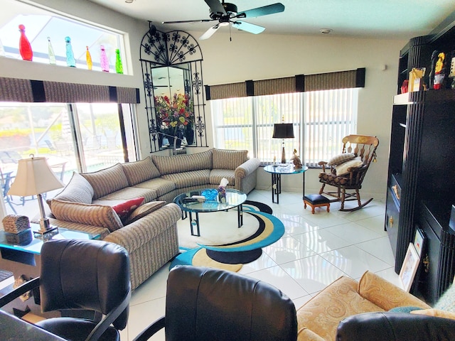 tiled living room featuring lofted ceiling and ceiling fan