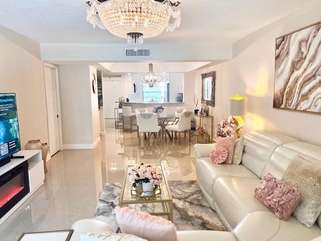 living room with an inviting chandelier