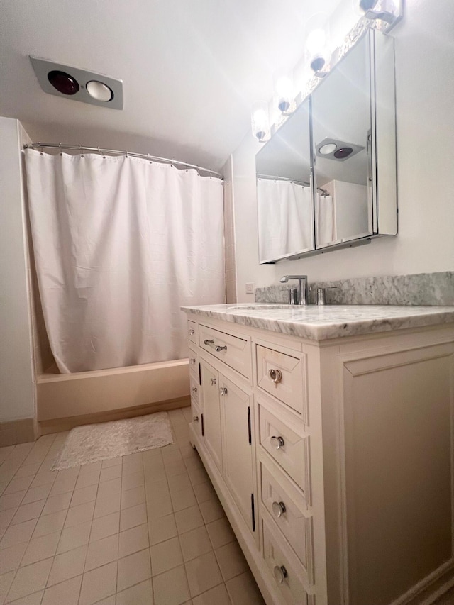 bathroom featuring shower / bath combination with curtain, vanity, and tile patterned floors