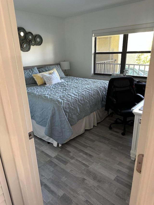 bedroom with hardwood / wood-style floors