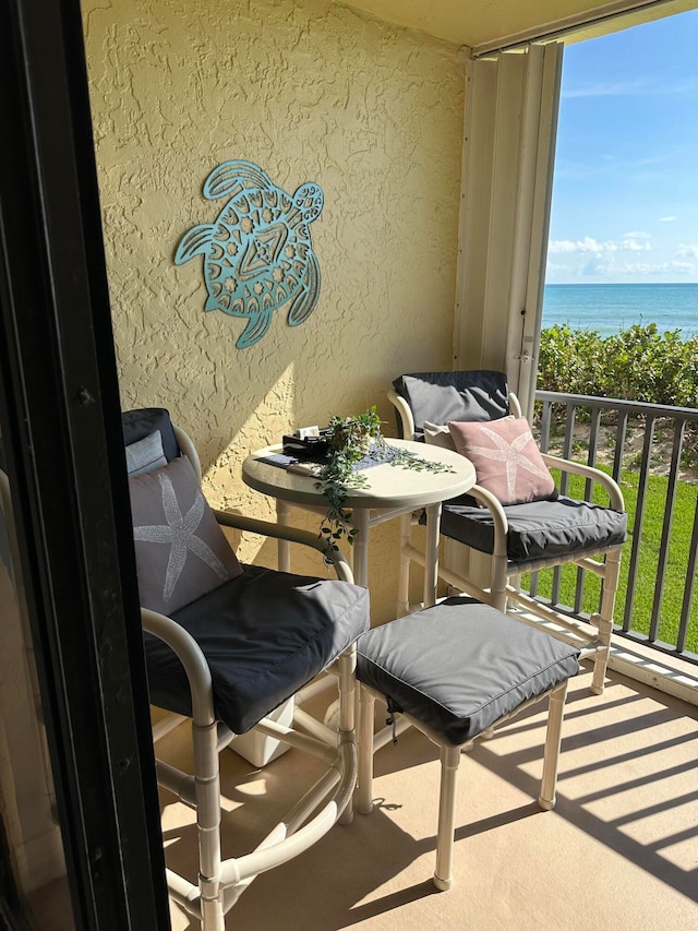 balcony featuring a water view