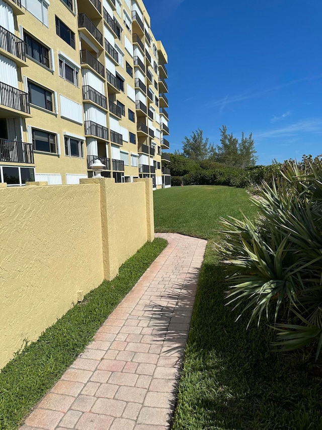 view of yard featuring a balcony