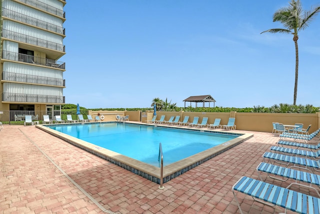 view of swimming pool with a patio