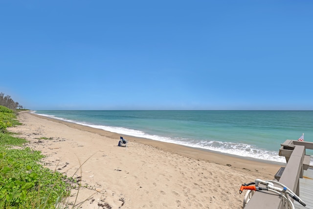 property view of water featuring a beach view