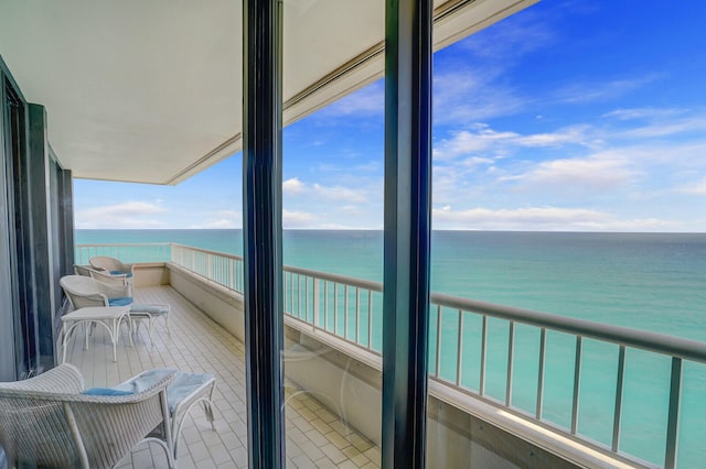 balcony featuring a water view