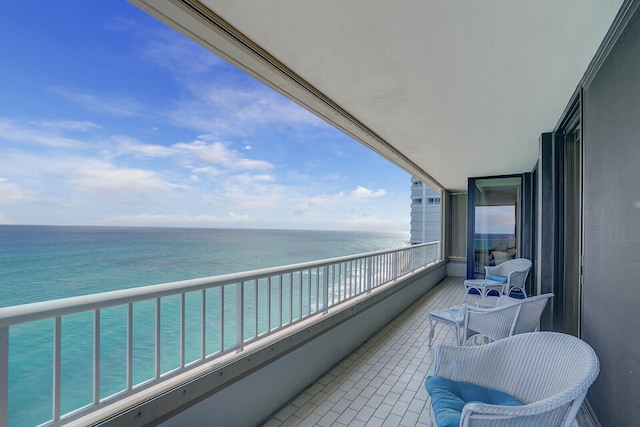 balcony featuring a water view