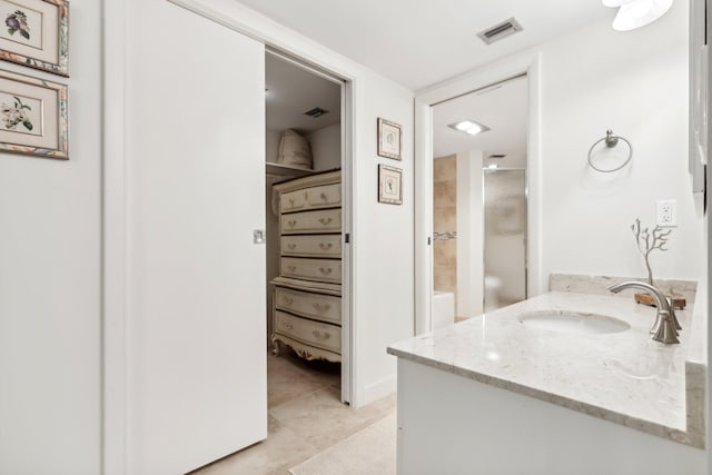 bathroom with vanity and walk in shower