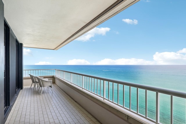 balcony featuring a water view