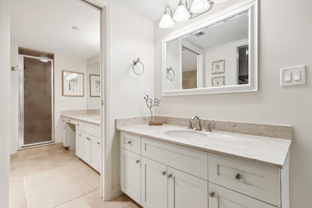 bathroom featuring vanity, tile patterned flooring, and an enclosed shower