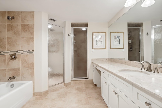 bathroom with vanity, shower with separate bathtub, and tile patterned floors