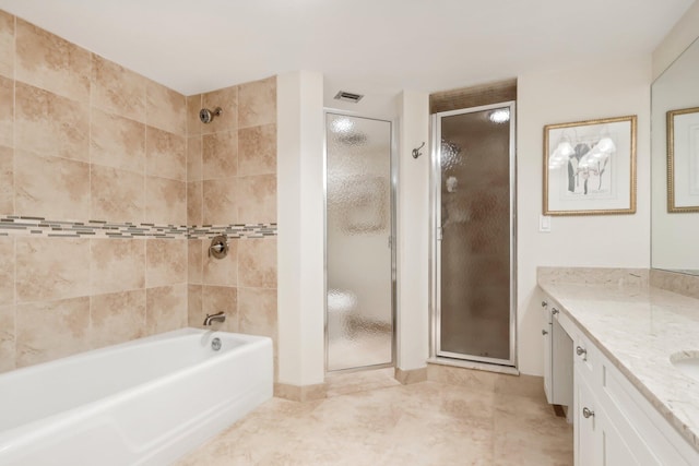 bathroom featuring vanity, plus walk in shower, and tile patterned flooring