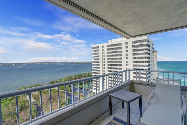 balcony featuring a water view