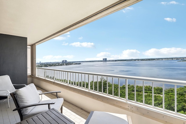 balcony featuring a water view