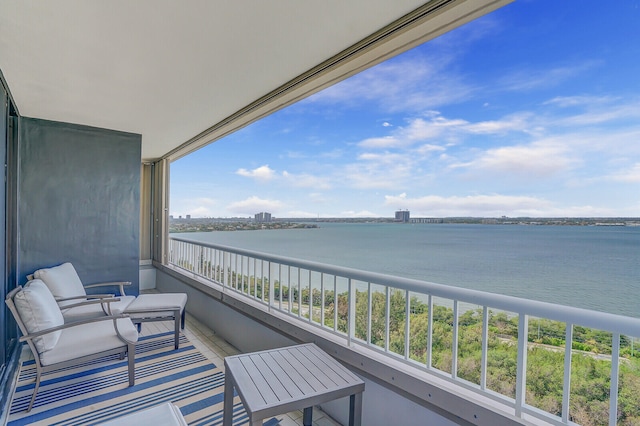 balcony featuring a water view