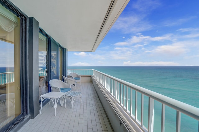 balcony featuring a water view