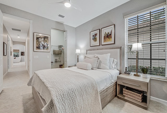 tiled bedroom with ceiling fan