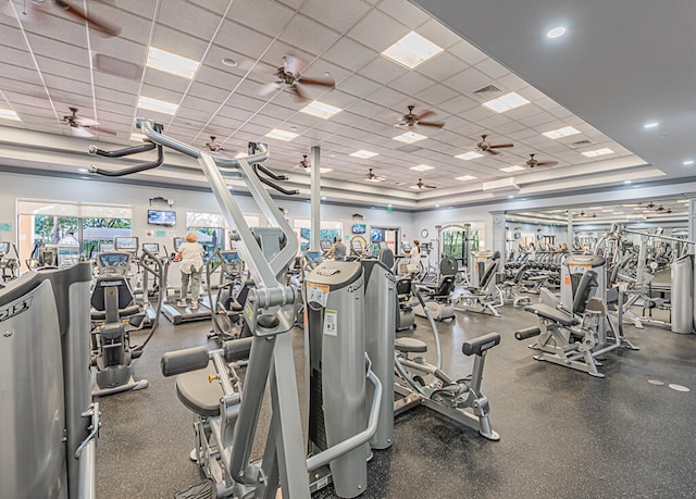 exercise room featuring a paneled ceiling