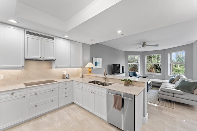 kitchen featuring dishwasher, kitchen peninsula, sink, decorative backsplash, and white cabinetry