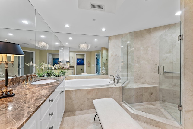 bathroom featuring tile patterned flooring, vanity, and independent shower and bath