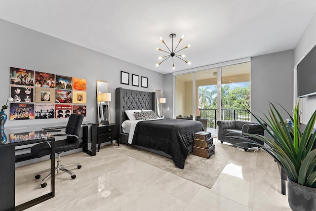 bedroom featuring access to outside and a chandelier