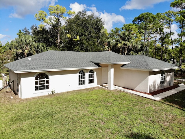 ranch-style house with a front lawn