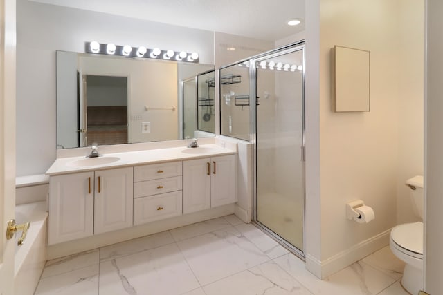 bathroom featuring toilet, vanity, and walk in shower