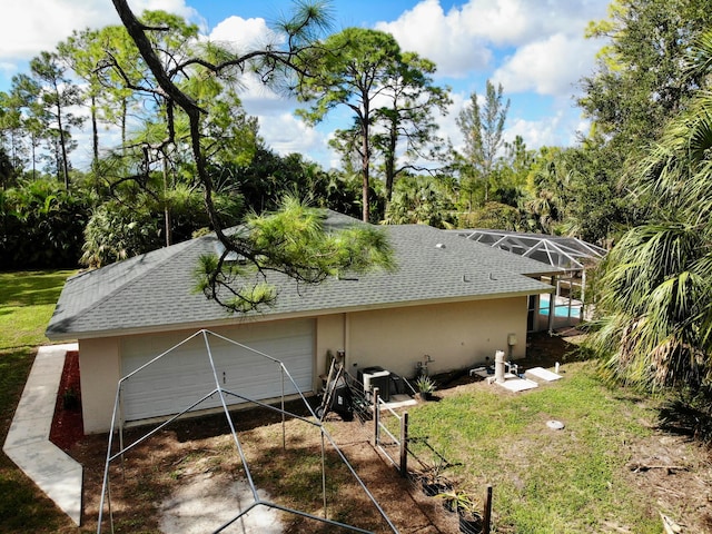 view of home's exterior featuring glass enclosure