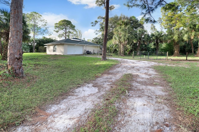 view of yard featuring a garage